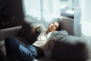 Adult in a calm reflective setting representing the pause between intense emotion and action.